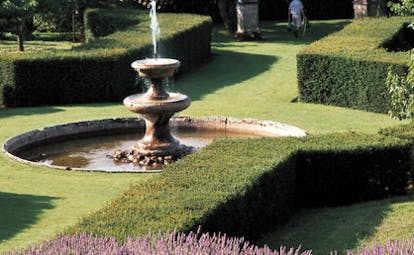 Chateau de Bagnols Rhone Valley gardens with topiary hedges fountains and lavender