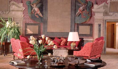 Chateau de Bagnols Rhone Valley lounge with frescos of cherubs and floral arrangements