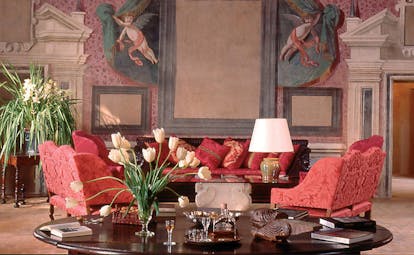 Chateau de Bagnols Rhone Valley lounge with frescos of cherubs and floral arrangements