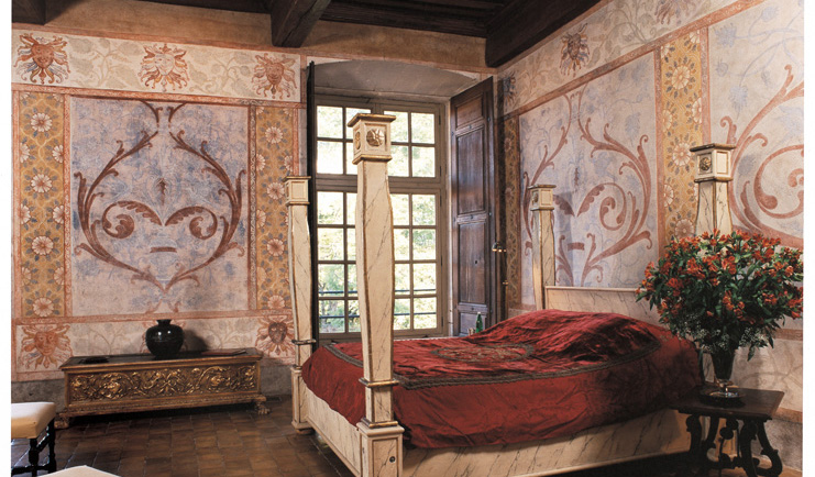 Chateau de Bagnols Rhone Valley suite chateau bedroom with frescos and four poster bed