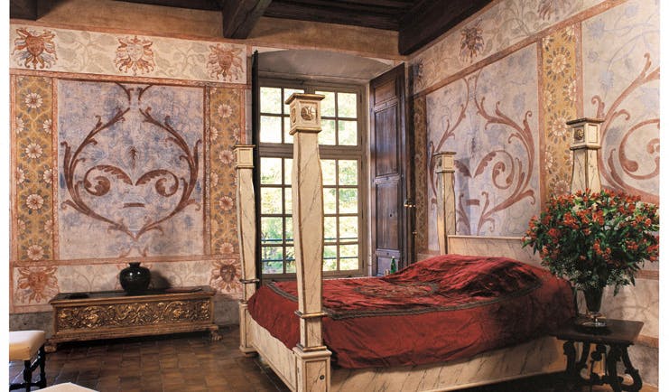 Chateau de Bagnols Rhone Valley suite chateau bedroom with frescos and four poster bed