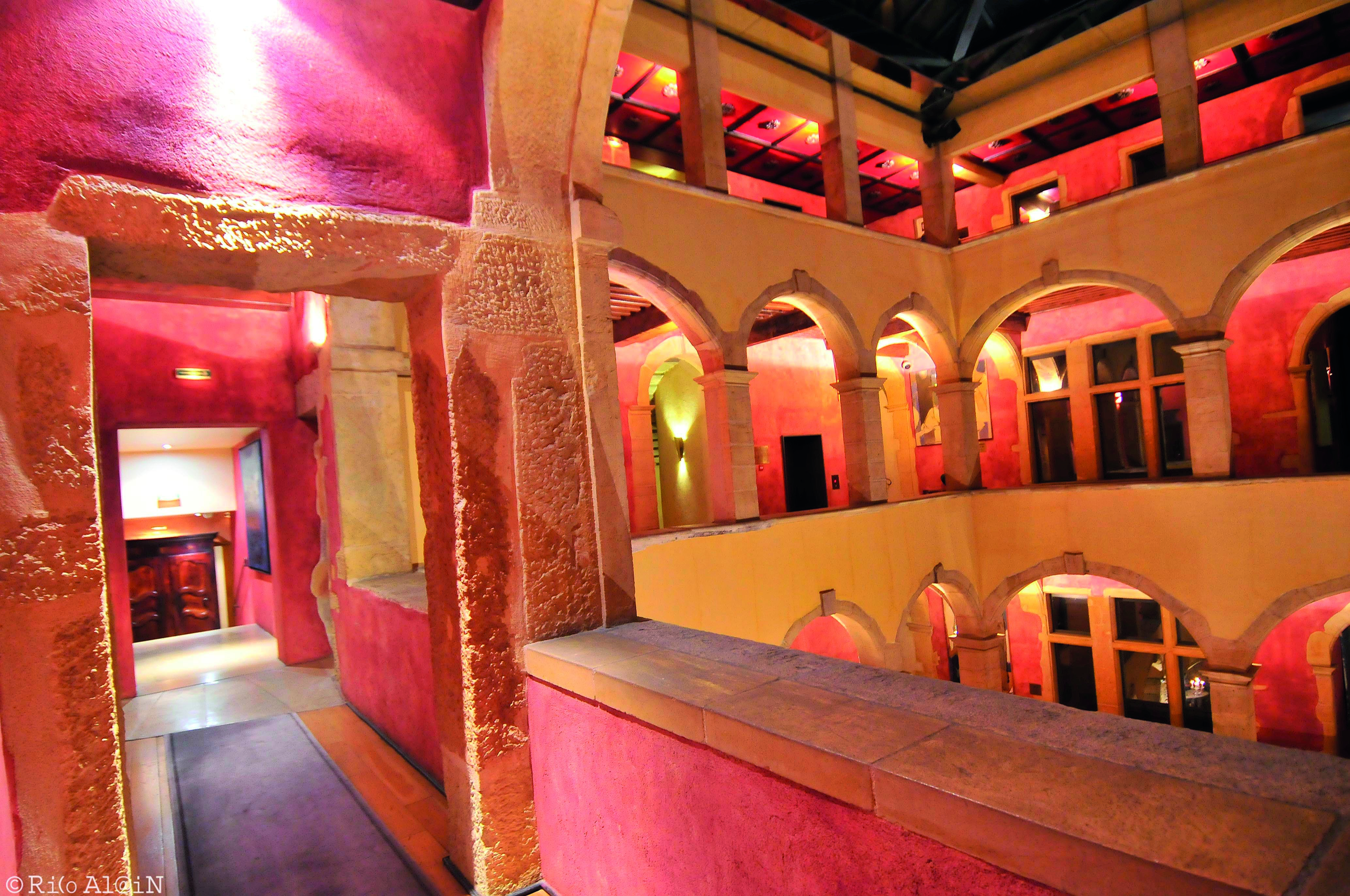 Hotel Cour des Loges Lyon interior building with red walls and archways
