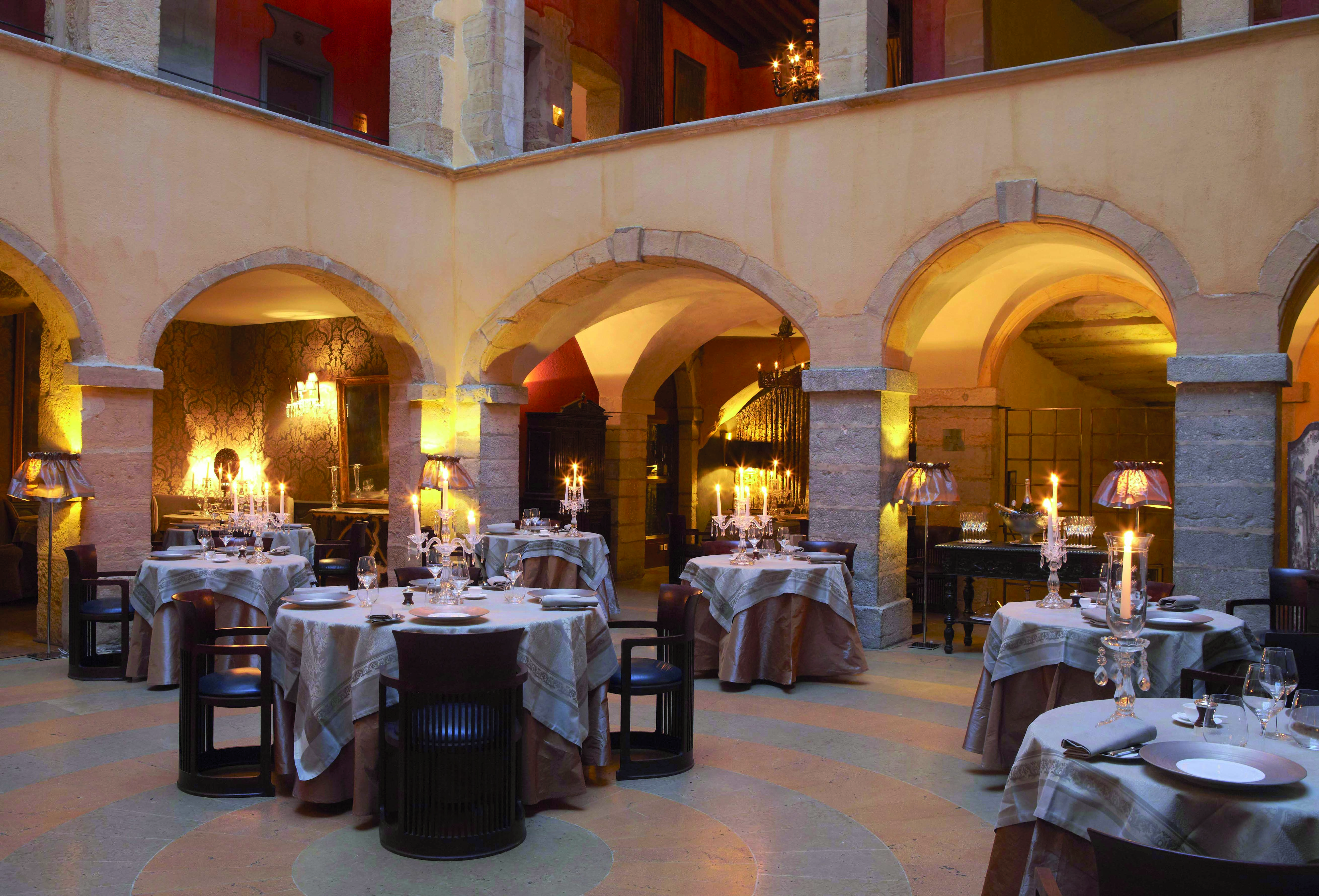 Hotel Cour des Loges Lyon restaurant dining room with candelabras and archways