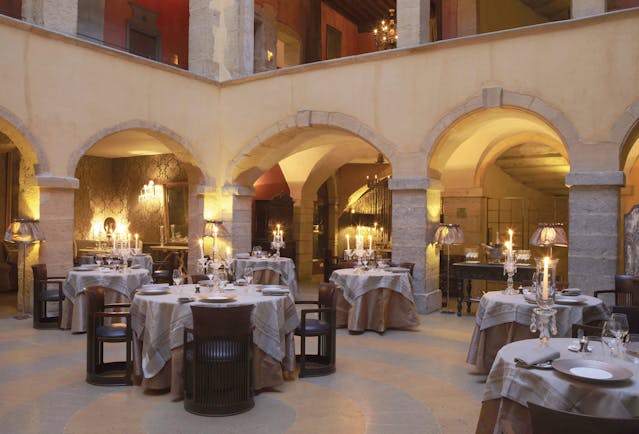 Hotel Cour des Loges Lyon restaurant dining room with candelabras and archways