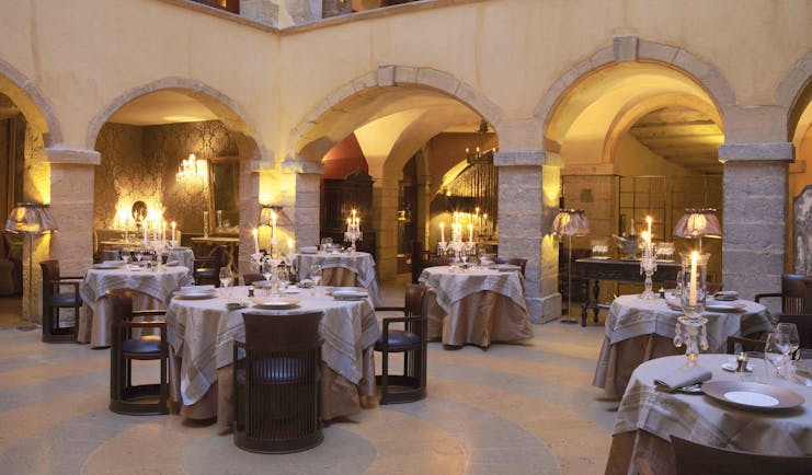 Hotel Cour des Loges Lyon restaurant dining room with candelabras and archways
