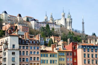 Lyon city centre with church and city buildings on a hillside