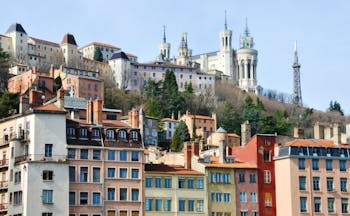 Lyon city centre with church and city buildings on a hillside