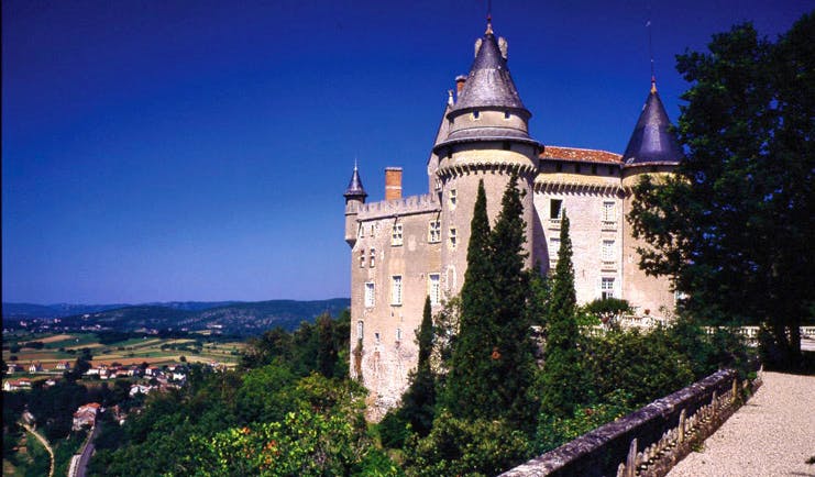 Chateau de Mercues Tarn and Lot exterior castle with grey roof overlooking countryside