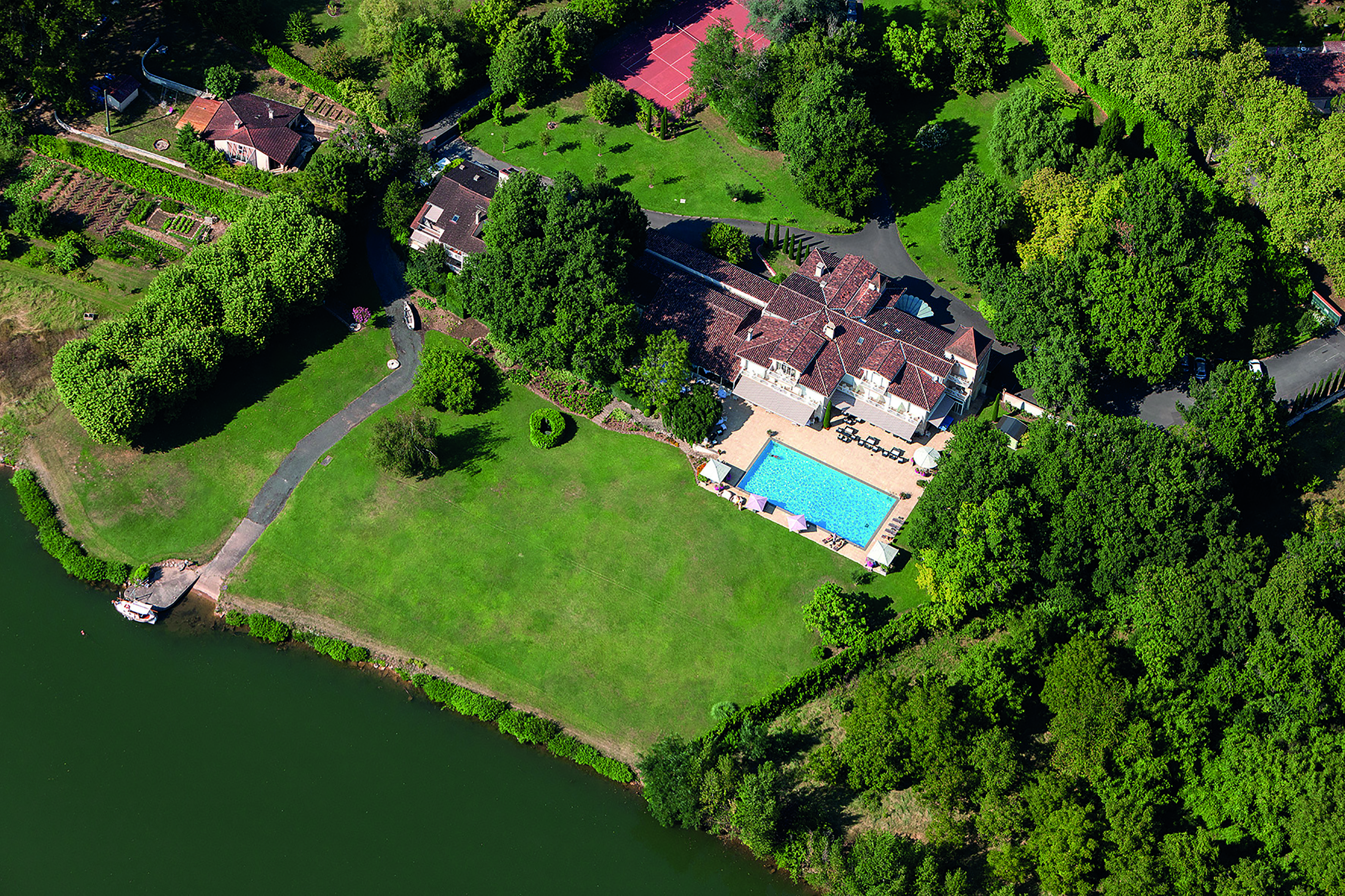 La Reserve Tarn and Lot aerial pool view and lawn next to a river
