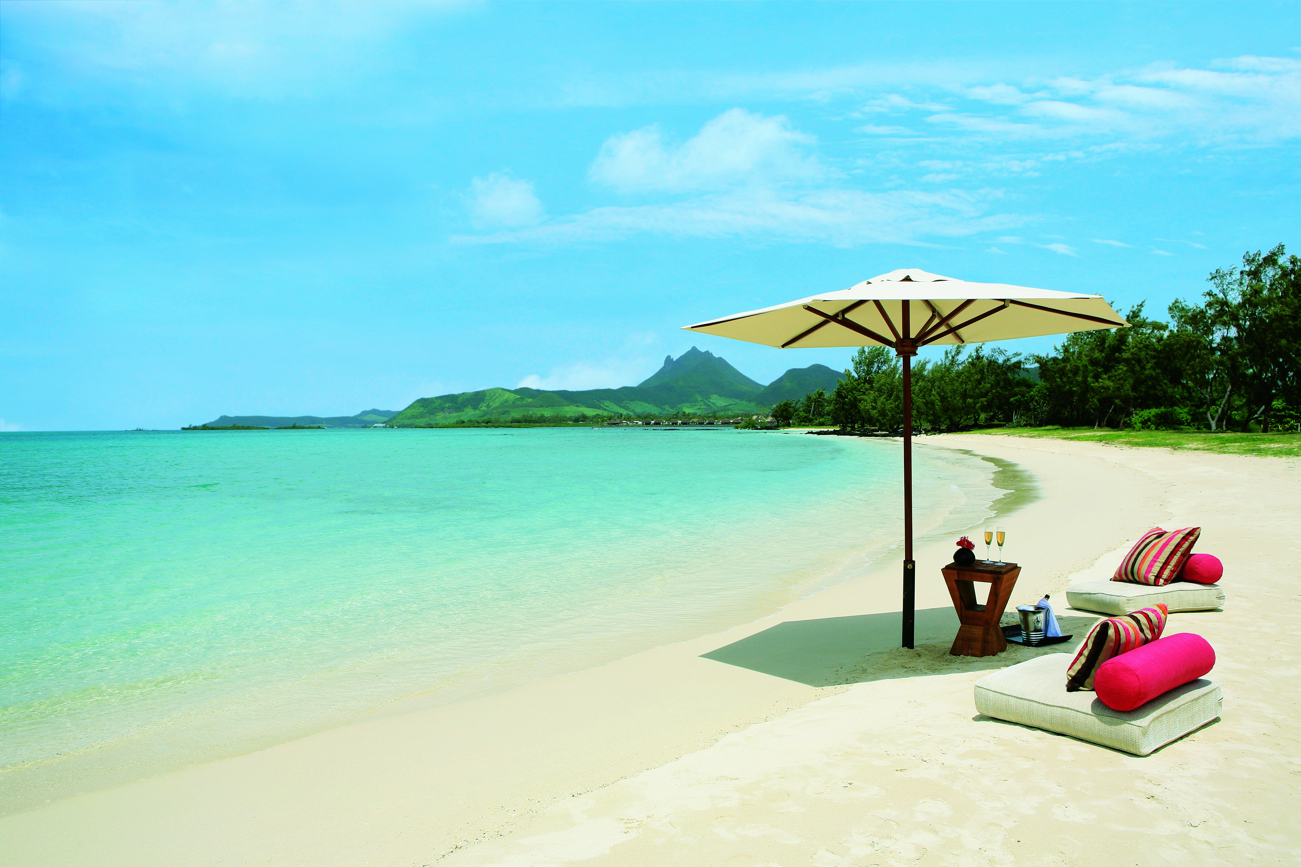 Anahita Mauritius beach seating area umbrella floor cushions
