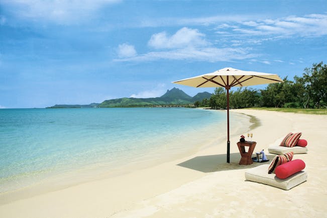 Anahita Mauritius beach seating area umbrella floor cushions