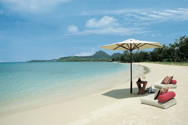 Anahita Mauritius beach seating area umbrella floor cushions