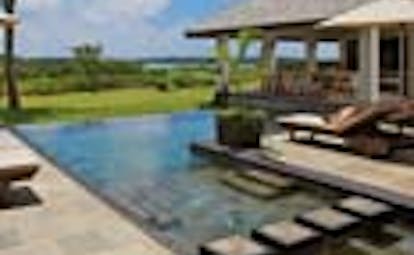 Anahita Mauritius swimming pool loungers outdoor dining pavilion lawns ocean