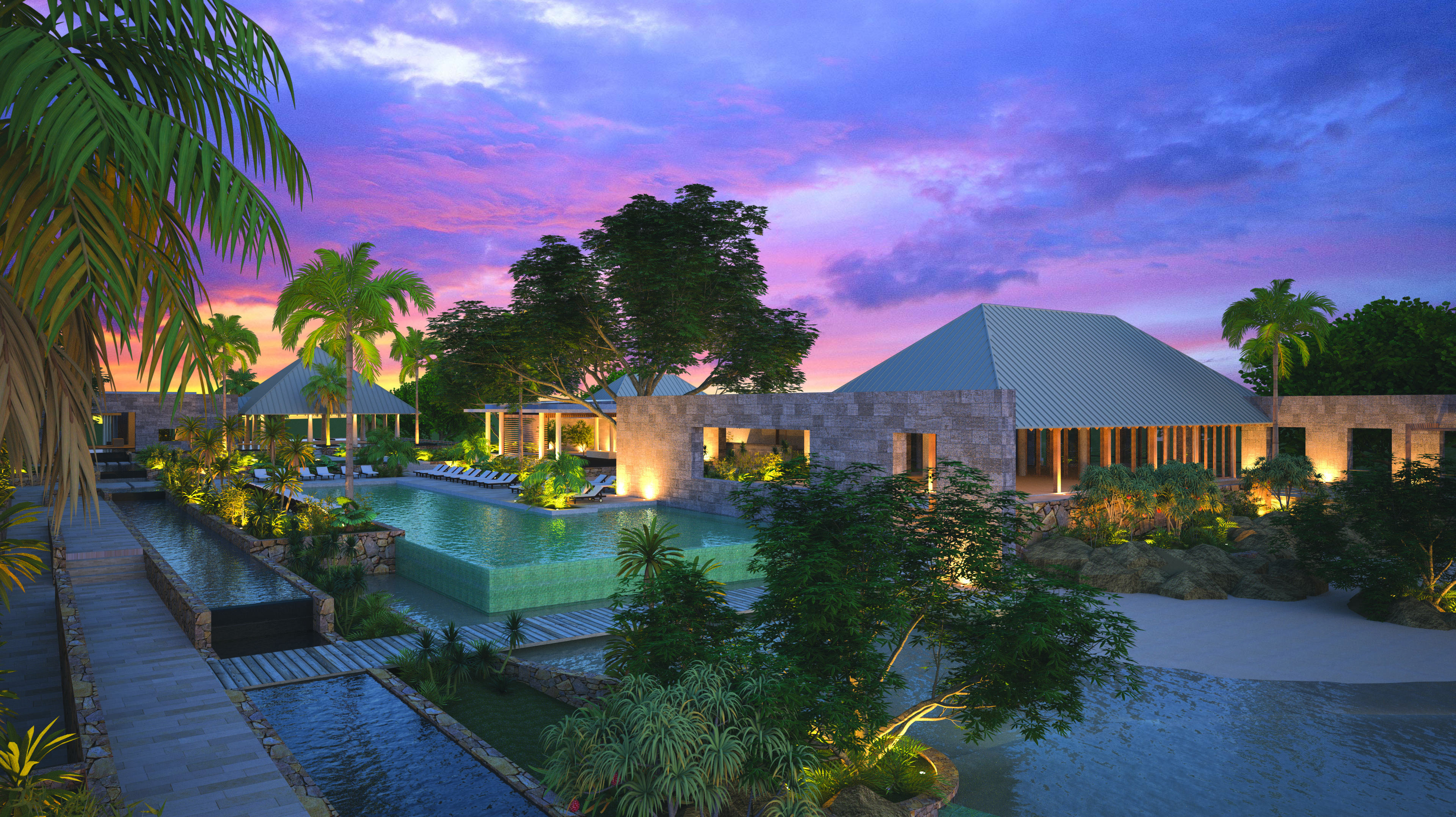 View of exterior of hotel and pool with pink sunset in the sky and hotel in back ground