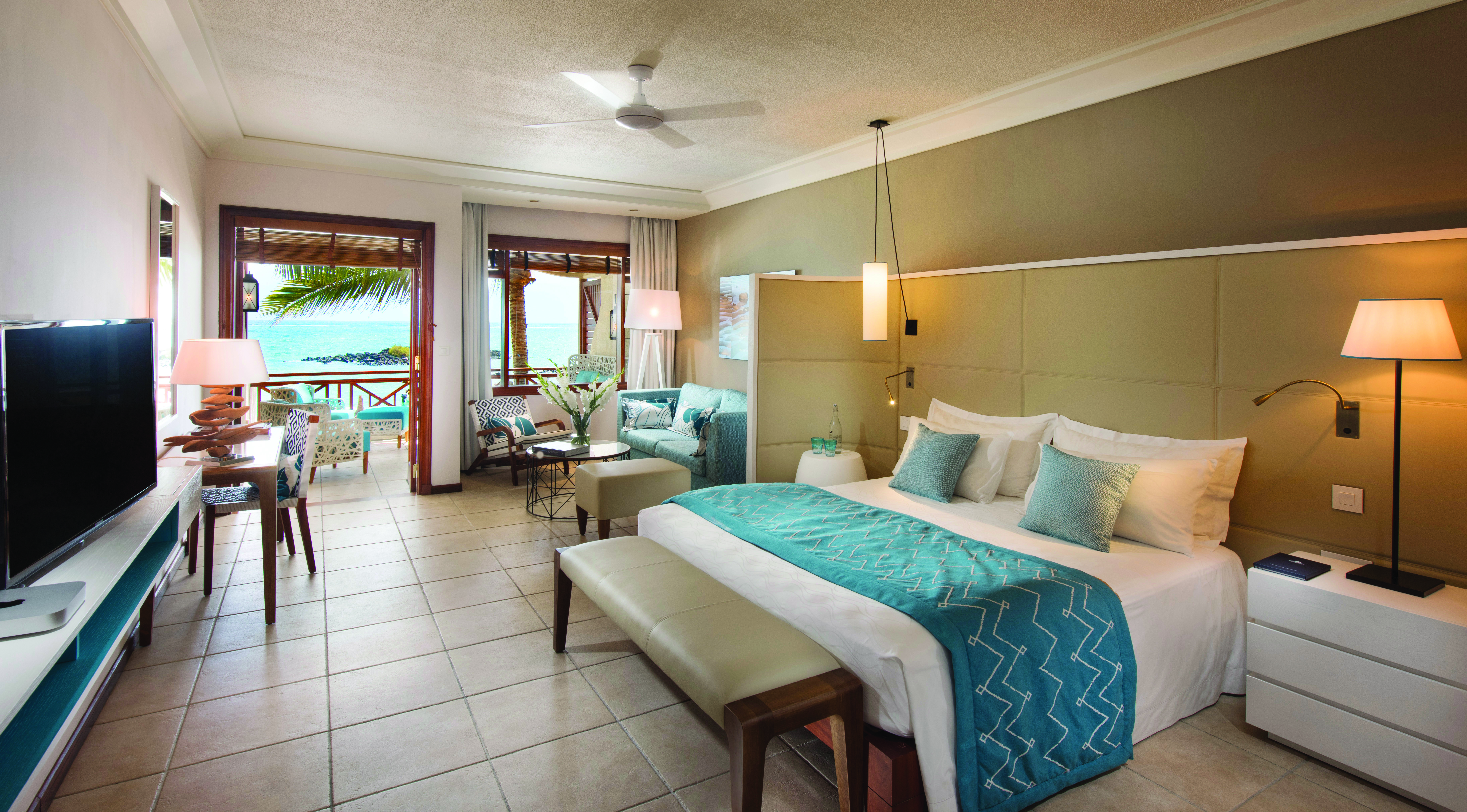 Constance Belle Mare Plage Mauritius junior suite bed lounge area modern décor sea views