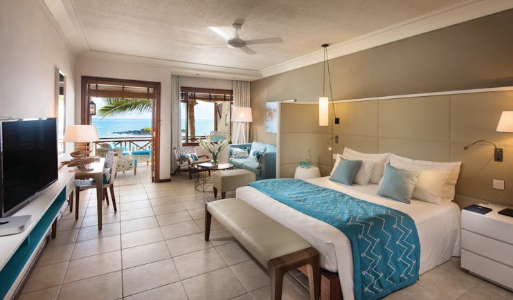 Constance Belle Mare Plage Mauritius junior suite bed lounge area modern décor sea views