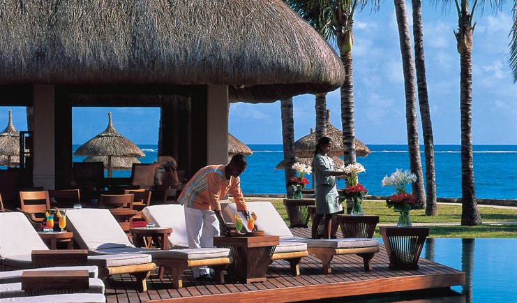 Constance Belle Mare Plage Mauritius terrace sun loungers overlooking pool