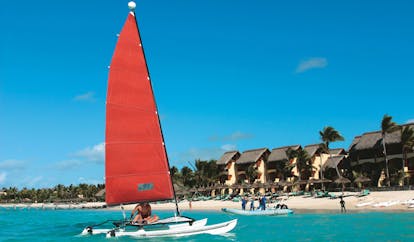 Constance Belle Mare Plage Mauritius water sports kayaks boats yachts on the water and beach