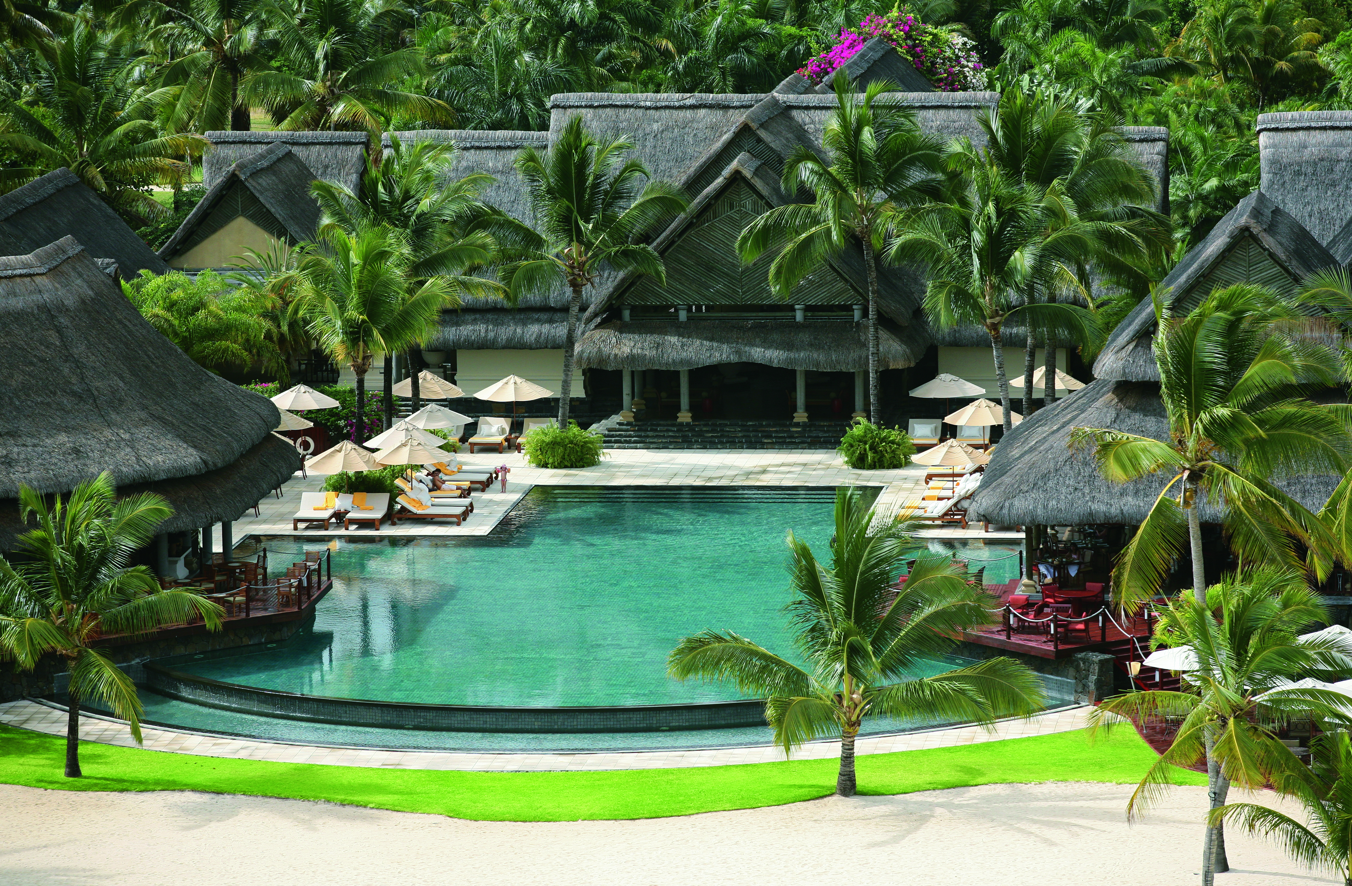 Constance Le Prince Maurice Mauritius pool sun loungers umbrellas palm trees