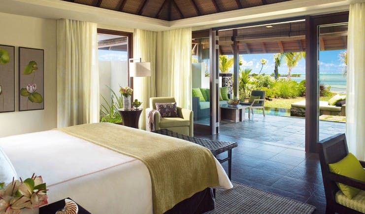 Four Seasons Mauritius bedroom modern decor patio area with sofa and ocean view