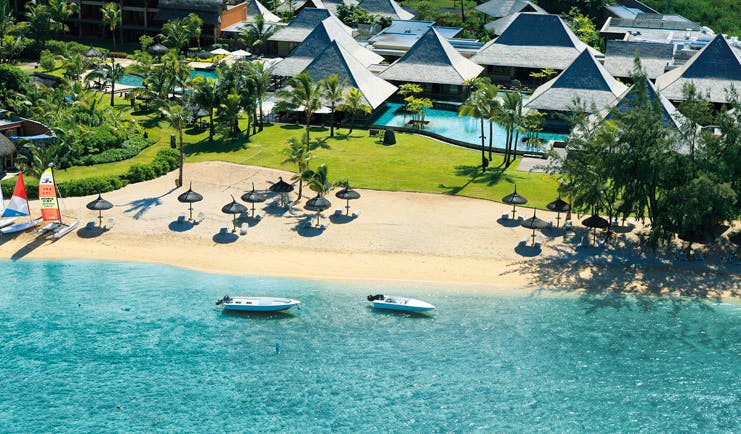 Heritage Awali Mauritius aerial view bungalows swimming pool beach boats and ocean