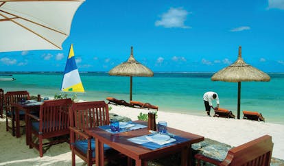 Heritage Awali Mauritius restaurant Infinity Blue outdoor beach front dining loungers ocean view