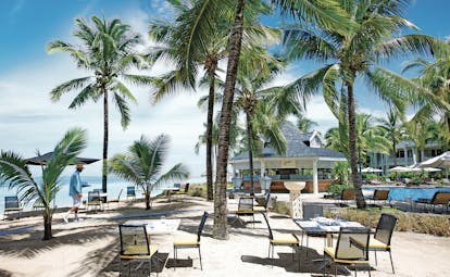 Le Telfair Mauritius beach dining outdoor seating palm trees