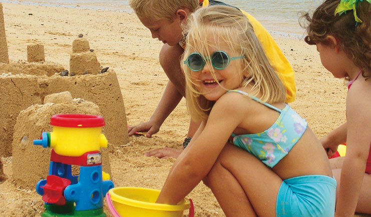 Le Telfair Mauritius beach kids building sandcastles playing in the sand