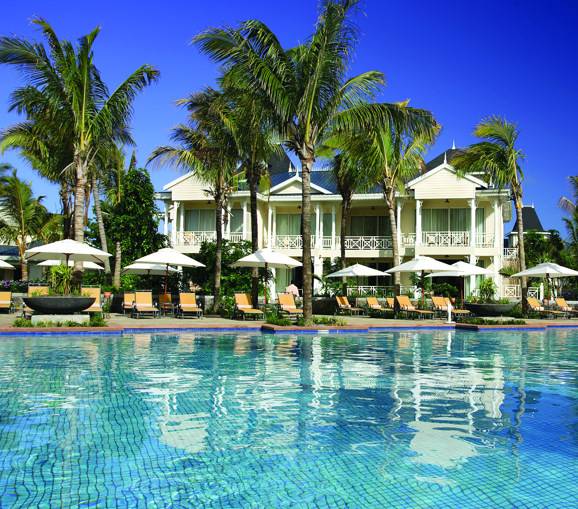Le Telfair Mauritius villa exterior overlooking beach palm trees white sand