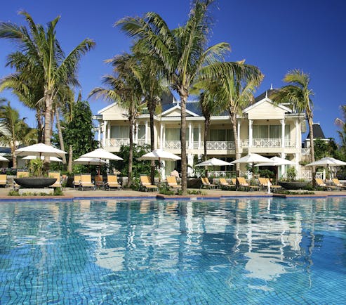 Le Telfair Mauritius villa exterior overlooking beach palm trees white sand