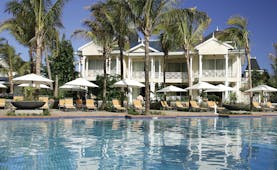 Le Telfair Mauritius villa exterior overlooking beach palm trees white sand