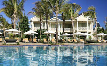 Le Telfair Mauritius villa exterior overlooking beach palm trees white sand