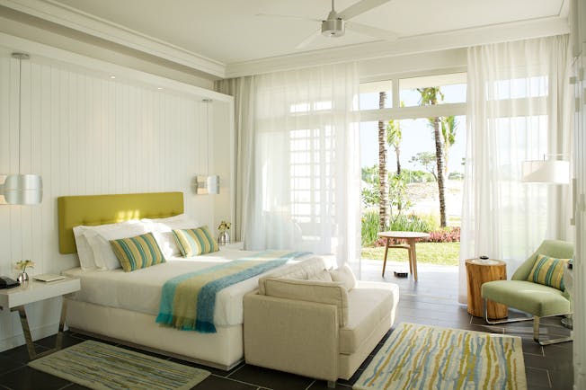 Long Beach junior suite, bed, sofa, doors leading to patio, bright modern decor