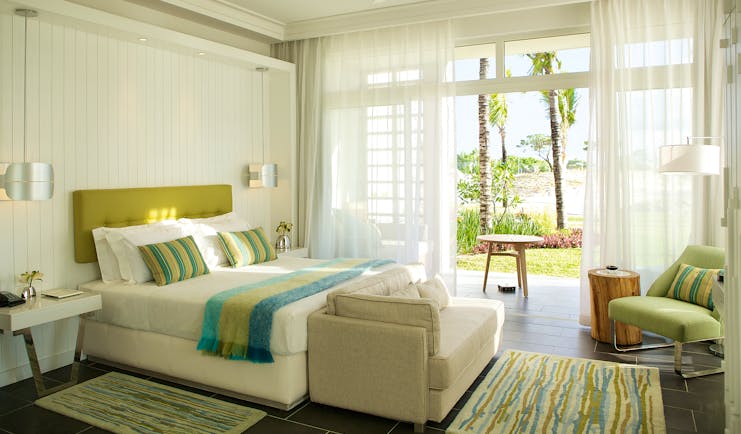 Long Beach junior suite, bed, sofa, doors leading to patio, bright modern decor