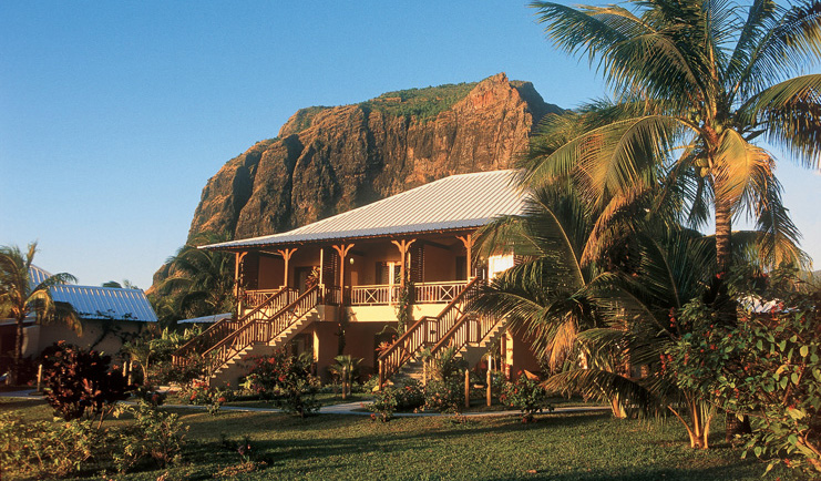 Lux Le Morne Mauritius exterior hotel building lawn trees mountain in background