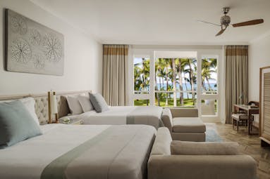 Ocean balcony twin room with two large beds with doors opening onto terrace balcony
