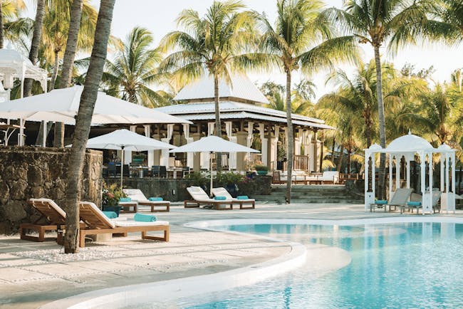 Paradise Cove swimming pool, sun loungers, umbrellas, palm trees