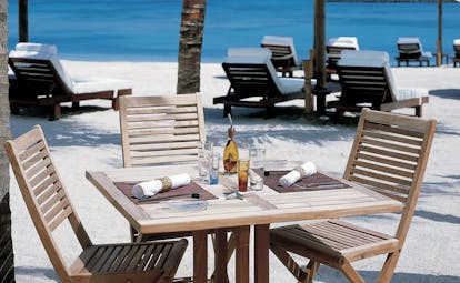Shangri La Le Touessrok Mauritius beach outdoor dining area sun loungers umbrellas