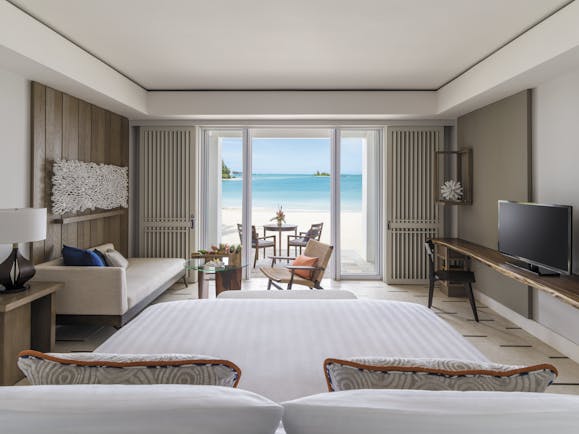 Shangri La Le Touessrok Mauritius hibiscus suite bedroom leading onto beach modern décor
