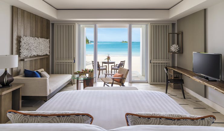 Shangri La Le Touessrok Mauritius hibiscus suite bedroom leading onto beach modern décor
