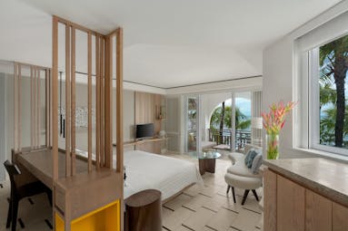 Junior suite with ocean view bedroom with large double bed and balcony looking over the ocean 