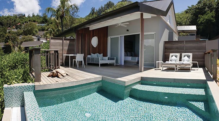 Carana Beach Hotel ocean view chalet exterior, decking sun loungers, priavte pool
