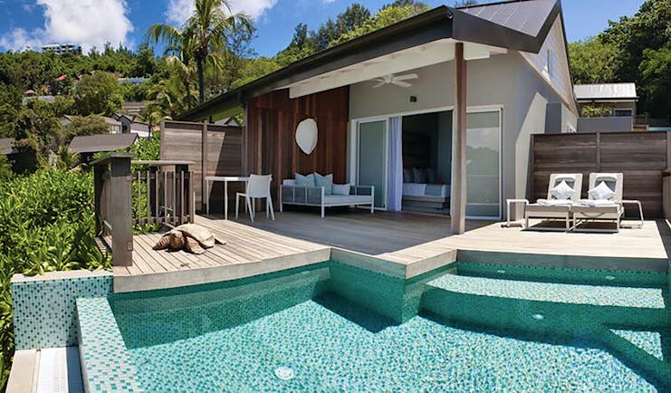 Carana Beach Hotel ocean view chalet exterior, decking sun loungers, priavte pool