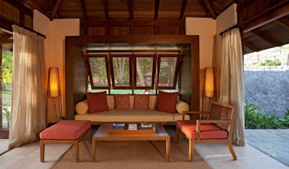 Constance Ephelia Resort Seychelles beach villa outdoor lounge sofa coffee table access to garden and to villa