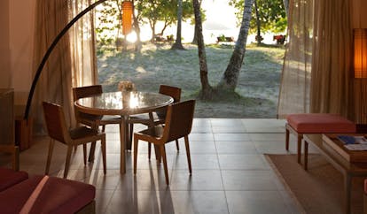 Constance Ephelia Resort Seychelles beach villa patio seating area beach view