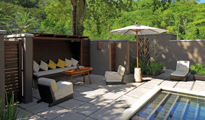 Constance Ephelia Resort Seychelles beach villa terrace sofa armchairs umbrellas private pool