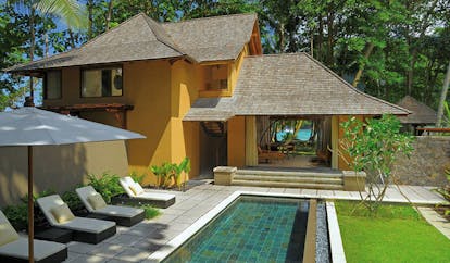 Constance Ephelia Resort Seychelles beach villa yellow building sun loungers private pool