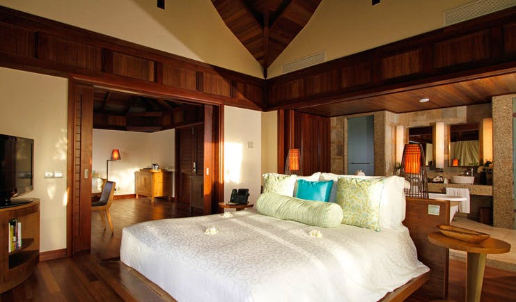 Constance Ephelia Resort Seychelles hillside villa bedroom open plan view of lounge