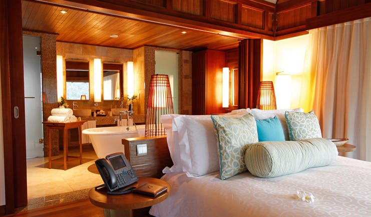 Constance Ephelia Resort Seychelles hillside villa interior open plan bedroom and bathroom