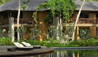 Constance Ephelia Resort Seychelles outdoor pool deck loungers flowers 